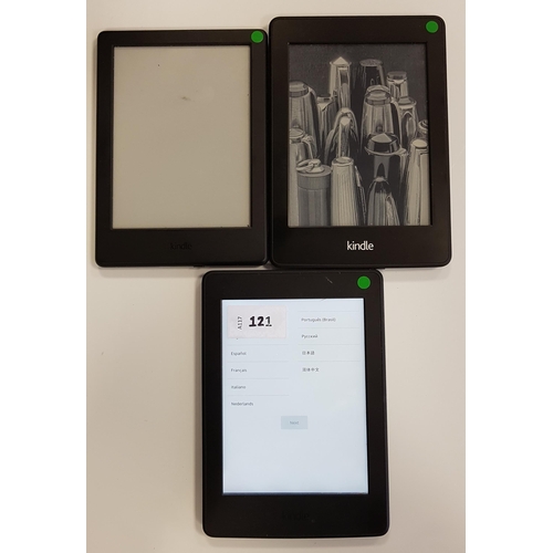 121 - THREE AMAZON KINDLE E-READERS
comprising a Paperwhite 3, serial number G090 G105 6265 03BJ; a Paperw... 