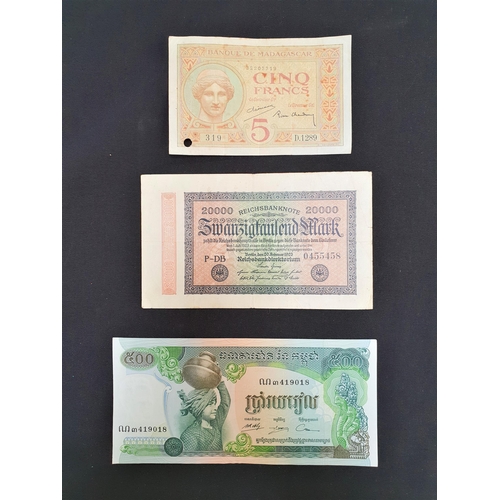 327 - THREE BANKNOTES
comprising Banque Du Cambodge, 500 Riels, serial number 419018, a German Reichsbankn... 