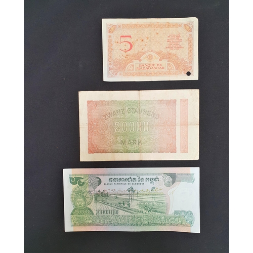 327 - THREE BANKNOTES
comprising Banque Du Cambodge, 500 Riels, serial number 419018, a German Reichsbankn... 