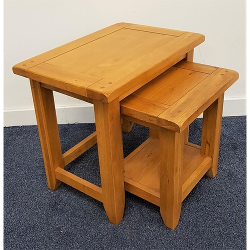 475 - NEST OF LIGHT OAK TABLES
with rectangular tops standing on shaped supports, 50cm high