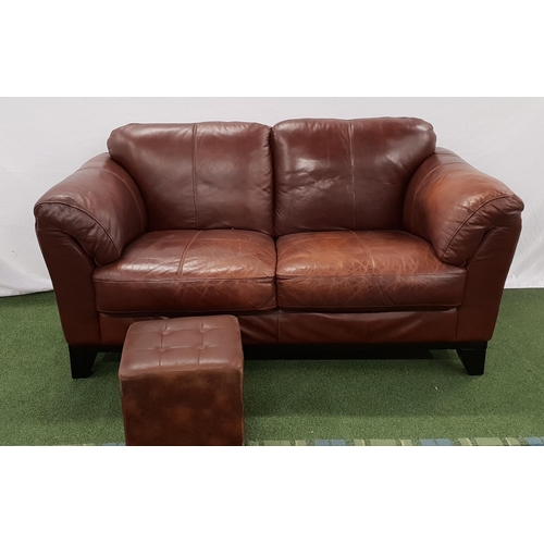 497 - BROWN LEATHER SOFA
with rollover arms, standing on stout shaped supports, 170cm long, together with ... 