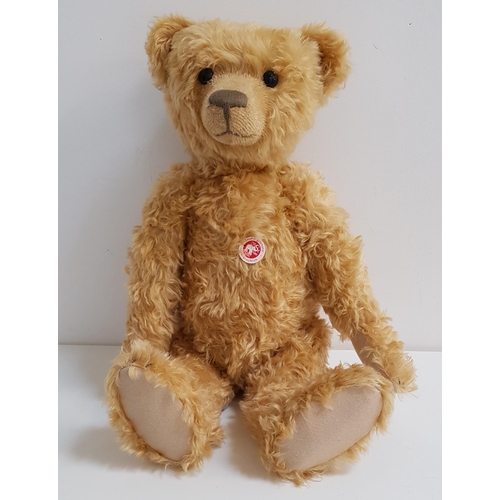 366 - STEIFF TEDDY BEAR 
in blond mohair, limited edition number 00619, with chest tag, button to ear and ... 