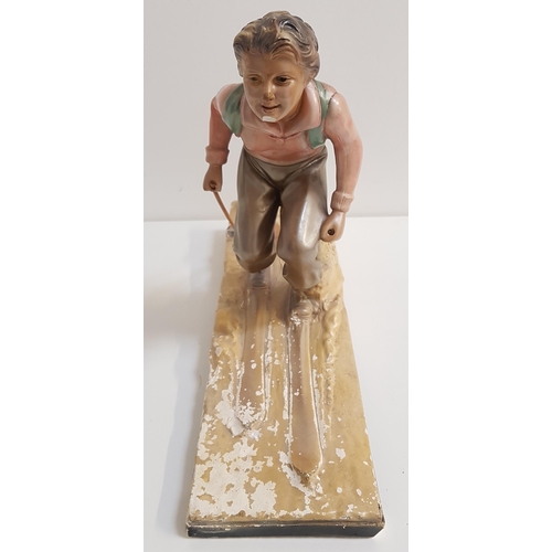 242 - ART DECO POLYCHROME PLASTER FIGURINE
of a female skier on a naturalistic rectangular base stamped OP... 