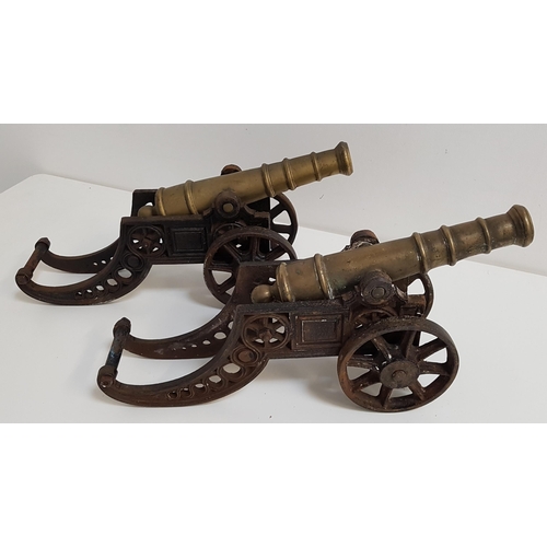 247 - PAIR OF TABLE CANNONS
with brass barrels and cast iron carriages, 47cm long (2)