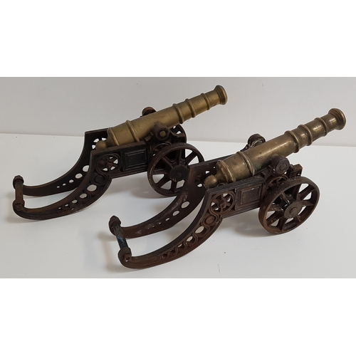 247 - PAIR OF TABLE CANNONS
with brass barrels and cast iron carriages, 47cm long (2)