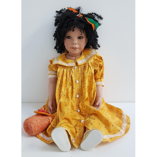 350 - SYLVIE CHERI CHAGALL BLACK DOLL
with porcelain head, arms and legs, wearing a yellow floral dress wi... 