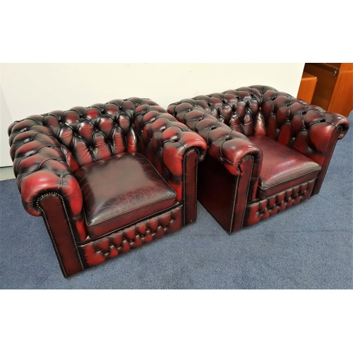 416 - PAIR OF CHESTERFIELD CLUB ARMCHAIRS
with deep button backs and arms with decorative metal stud detai... 