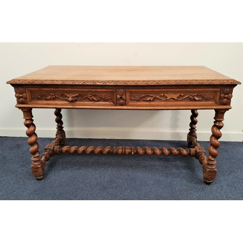 422 - CARVED OAK SIDE TABLE
with a rectangular carved edge top above two frieze drawers with green man mas... 