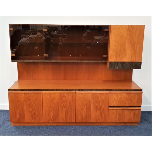 448 - ILLUMINATED TEAK SIDE CABINET
with three smoked glass cupboard doors and an arrangement of cupboards... 