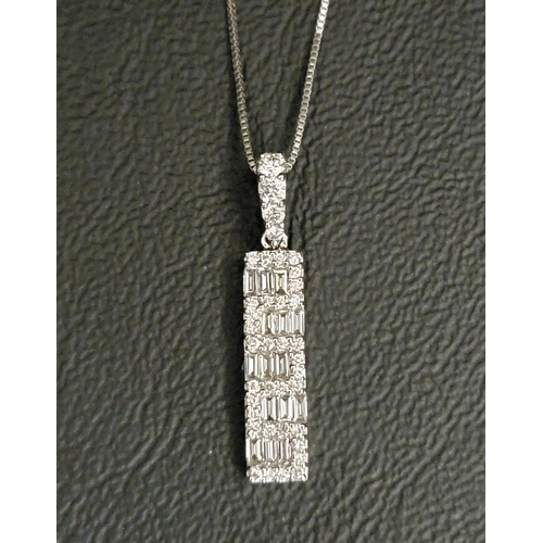 63 - DIAMOND SET PENDANT 
in eighteen carat white gold, the round and baguette cut diamonds in linear wav... 