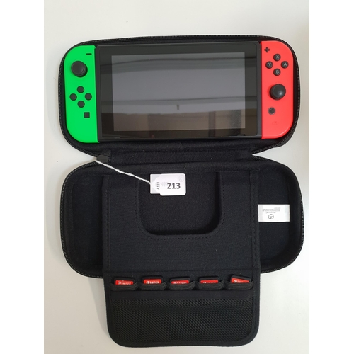 213 - NINTENDO SWITCH 
S/N: XAJ40067777026, in a Nintendo Switch case with five games comprising Crash Ban... 