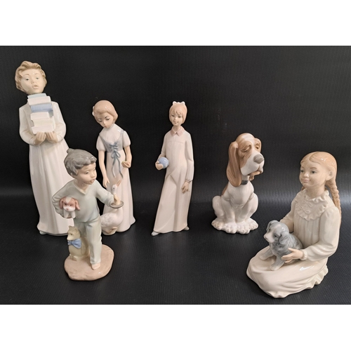 217 - FOUR NAO FIGURINES
comprising Night Lite, 19.5cm high, Boy Carrying Books, 28cm high, Girl Sitting W... 