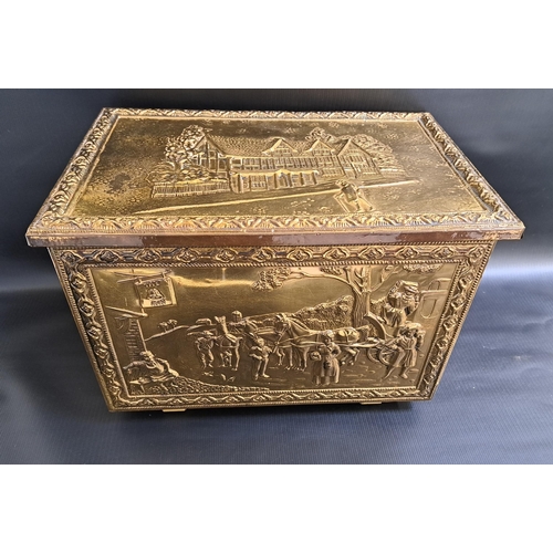 298 - BRASS EMBOSSED COAL BIN
with hammered decoration and tavern scenes, 46cm wide