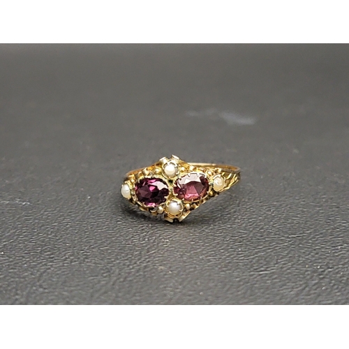 166 - VICTORIAN GARNET AND SEED PEARL RING
in 12.5 carat gold with scroll decorated setting and engraved s... 