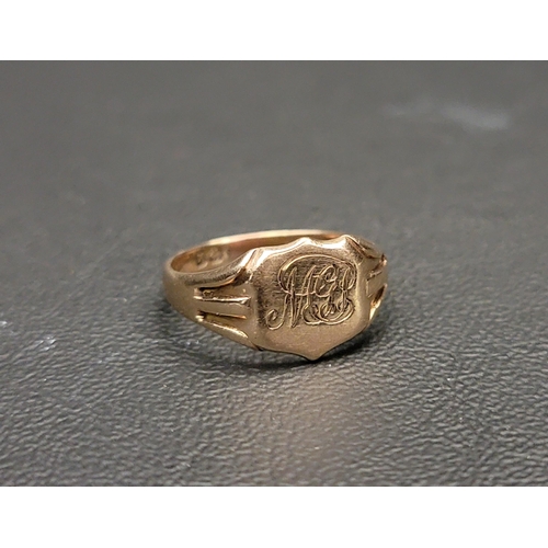 175 - GOLD SIGNET RING
with engraved monogram to the central shaped panel, ring size M and approximately 2... 