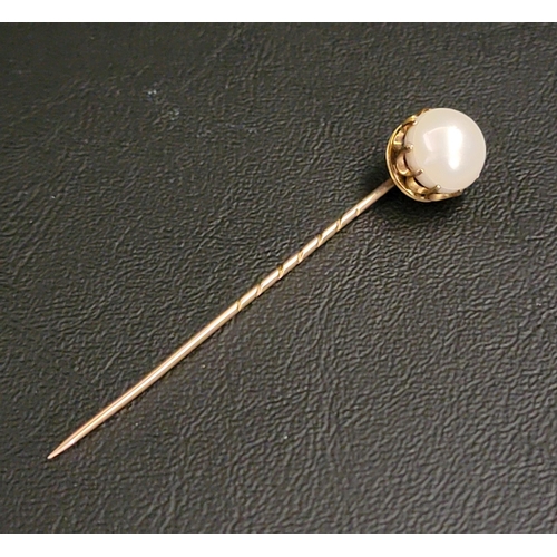 179 - PEARL SET STICK PIN
in unmarked high carat gold mount