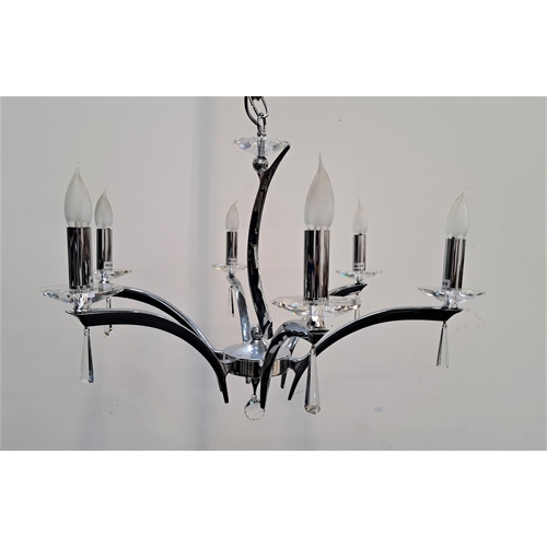 442 - CHROME AND GLASS CHANDELIER
with a shaped chrome central column with six shaped chrome arms and a ce... 