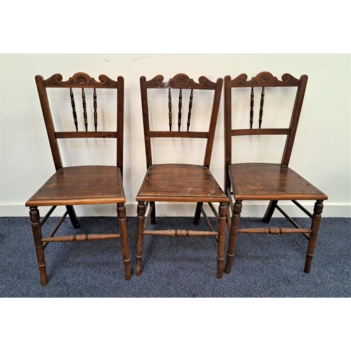 459 - THREE EDWARDIAN MAHOGANY SIDE CHAIRS
with shaped and carved top rails above three turned columns wit... 