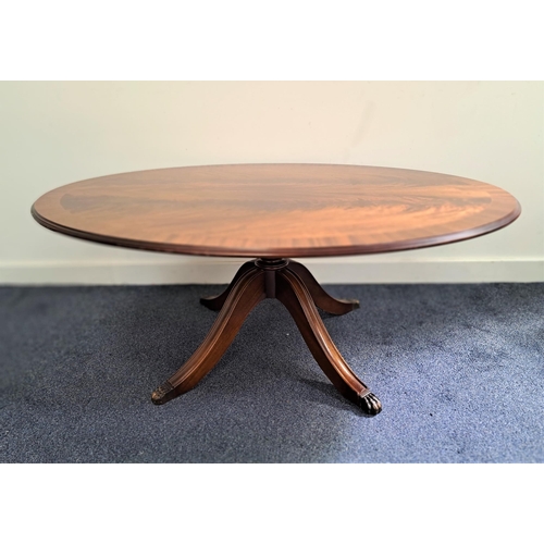 479 - MAHOGANY AND CROSSBANDED OCCASIONAL TABLE
with an oval top, standing on a turned column with four ou... 