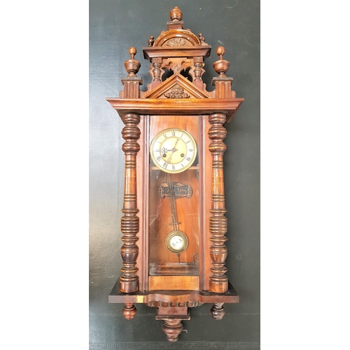 VIENNA STYLE REGULATOR WALL CLOCK
in an oak and mahogany case with a circular dial with Roman numerals and an eight day movement, 109cm high