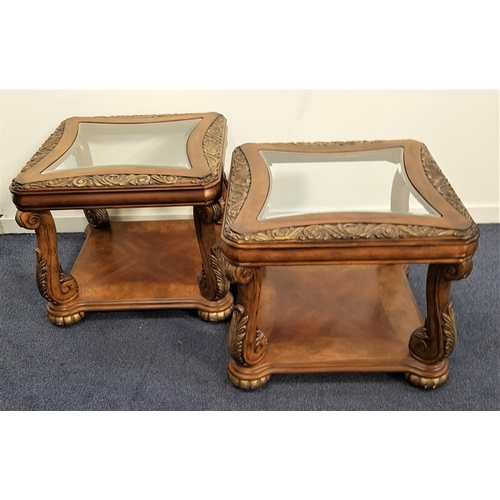 467 - PAIR OF WALNUT OCCASIONAL TABLES
with a shaped inset glass top and scroll carved borders, on scroll ... 