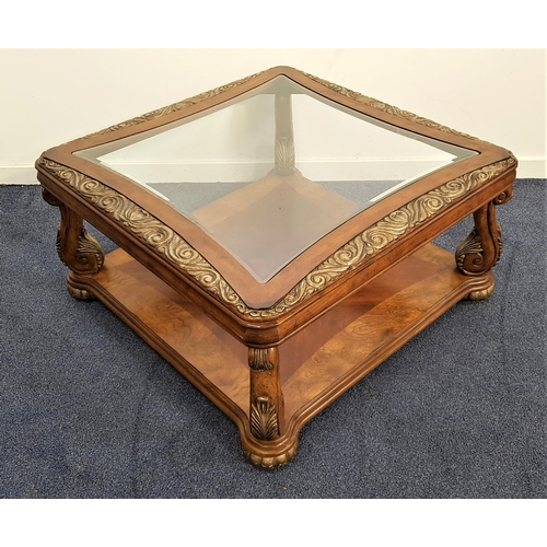 468 - LARGE WALNUT OCCASIONAL TABLE
with a shaped inset glass top and scroll carved borders, on scroll sup... 