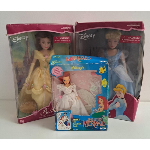 392 - TWO DISNEY PORCELAIN DOLLS
Cinderella and Belle, both boxed, 43cm high, together with Disney The Lit... 