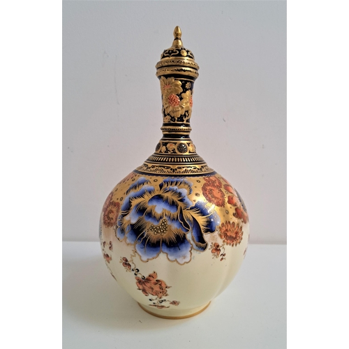 229 - ROYAL CROWN DERBY BALUSTER VASE AND COVER
with a bottle neck, decorated in the Chinese pattern, 28cm... 