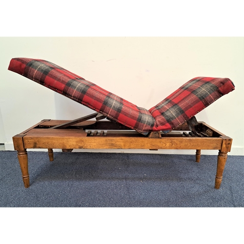 426 - EDWARDIAN ADJUSTABLE DAY BED
with an oak and mahogany frame and a padded bed with adjustable head an... 