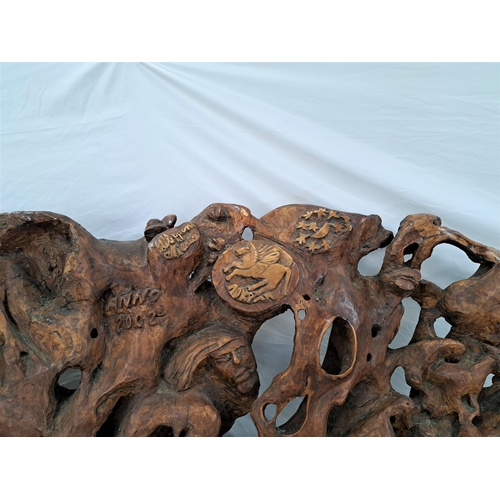 480 - CARVED OLIVE WOOD ROOT BENCH
of natural shaped form, the bench carved with masks, figures, animals, ... 