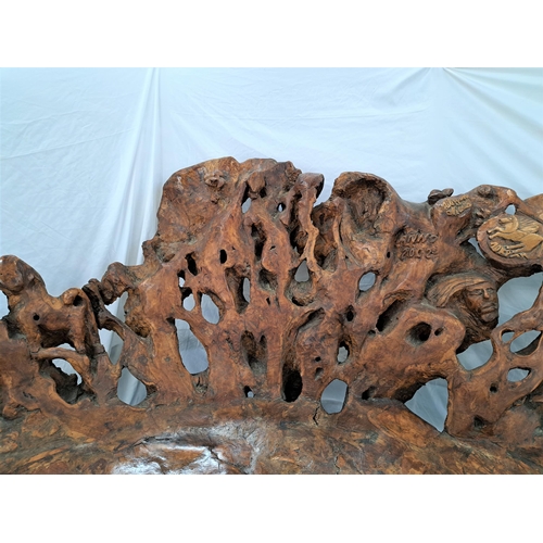 480 - CARVED OLIVE WOOD ROOT BENCH
of natural shaped form, the bench carved with masks, figures, animals, ... 