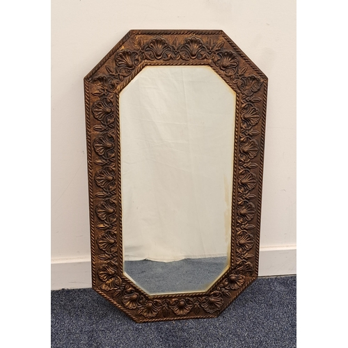 453 - OCTAGONAL BRASS EMBOSSED WALL MIRROR
with a bevelled plate, 74cm high