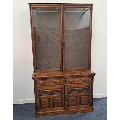 462 - EDWARDIAN OAK BOOKCASE
with a pair of glass doors opening to reveal adjustable shelves, the base wit... 