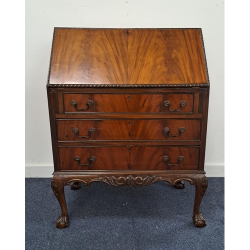 484 - MAHOGANY BUREAU
with an inset fall flap and fitted interior above three cockbeaded drawers, standing... 