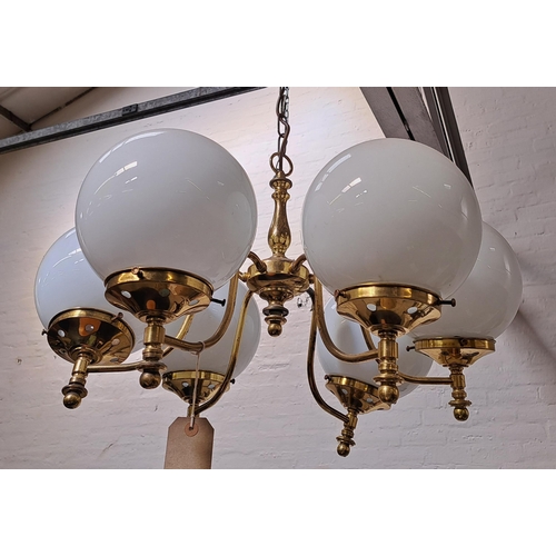 492 - LARGE GILT BRASS CEILING LIGHT
the shaped central body with suspension chain and six scroll arms wit... 