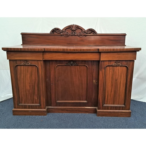 19th CENTURY MAHOGANY INVERTED BREAKFRONT SIDEBOARD
with a carved raised back above three frieze drawers and three carved panelled doors, standing on a plinth base, 173cm x 130cm