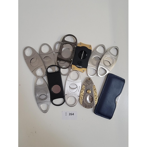 264 - TWELVE CIGAR CUTTERS
of various size and design