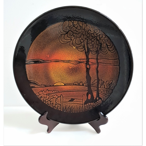 150 - POOLE POTTERY AGEAN CHARGER
with a dark brown border encasing a sunset over fields, 35cm diameter