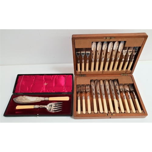 124 - WALKER & HALL SILVER PLATED FISH SERVERS
comprising a knife and fork with ivorine handles, in a fitt... 