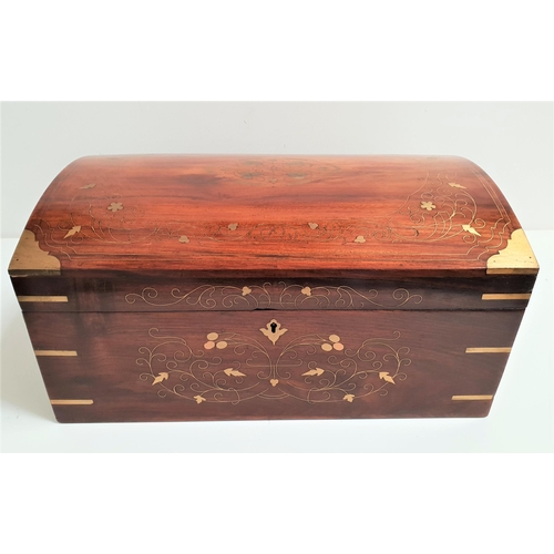 187 - TEAK CASKET
with floral brass inlay and side handles with a domed lid opening to reveal a lift out t... 