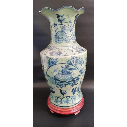 149 - CHINESE VASE
with a frilled collar and decorated with fans and flowers, 46cm high