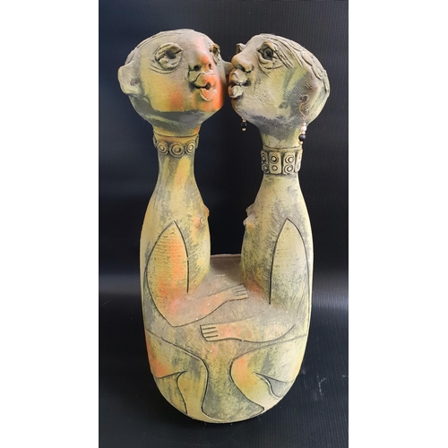 152 - STUDIO POTTERY DOUBLE DECANTER
depicting two African women, each with a removeable head, 40cm high