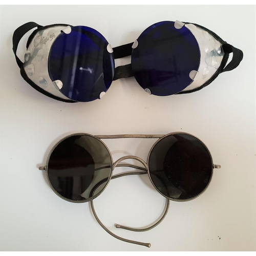 274 - TWO PAIRS OF VINTAGE SUNGLASSES
one with metal side guards and blue lenses, the other with brown lea... 