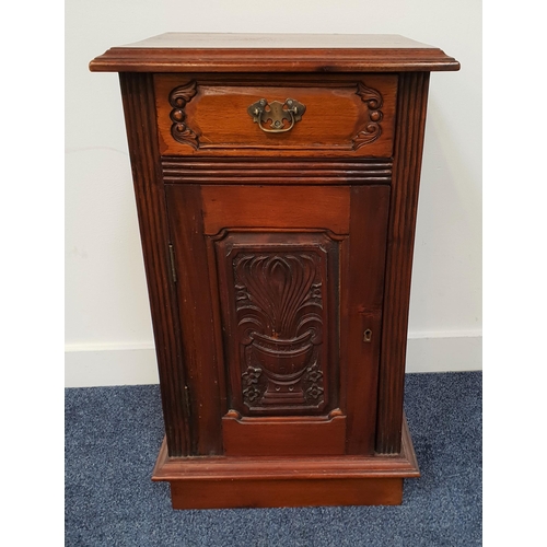 416 - TEAK SIDE CABINET
the moulded top above a carved frieze drawer with a carved cupboard door below, st... 