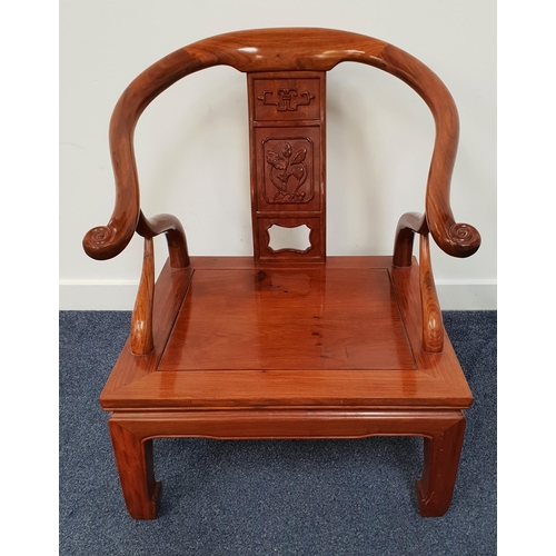 429 - CHINESE HORSESHOE ARMCHAIR
with a central carved splat above a panelled seat standing on shaped supp... 