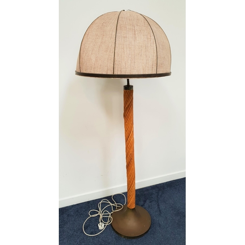 437 - 1970s STANDARD LAMP
raised on a circular brass base with a spiral cane column with a double bulb fit... 