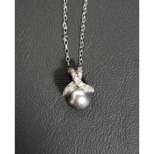 88 - TAHITIAN PEARL AND DIAMOND PENDANT
the diamonds set to the decorative crossover suspension loop, in ... 