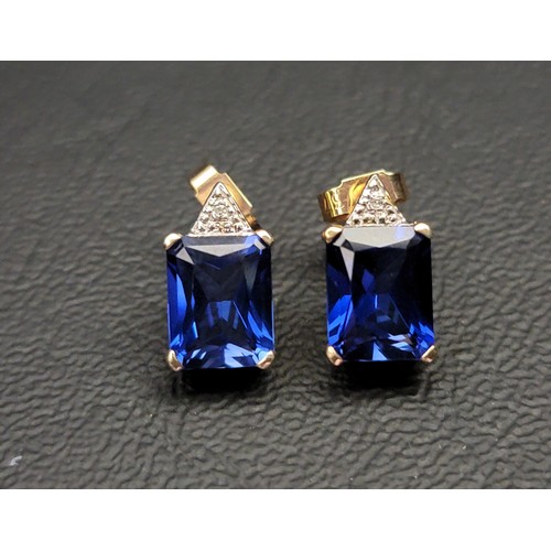 99 - PAIR OF SAPPHIRE AND DIAMOND EARRINGS
each of the emerald cut sapphires with small diamonds above, i... 