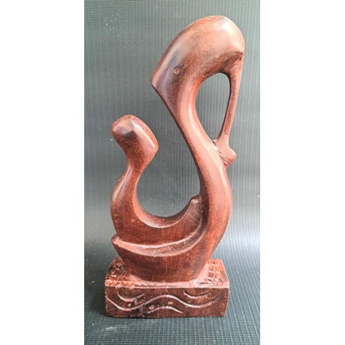 214 - FESTUS IDEHEN (Nigerian b.1928)
mother and child, carved teak, signed Festus to the base, 19.5cm hig... 