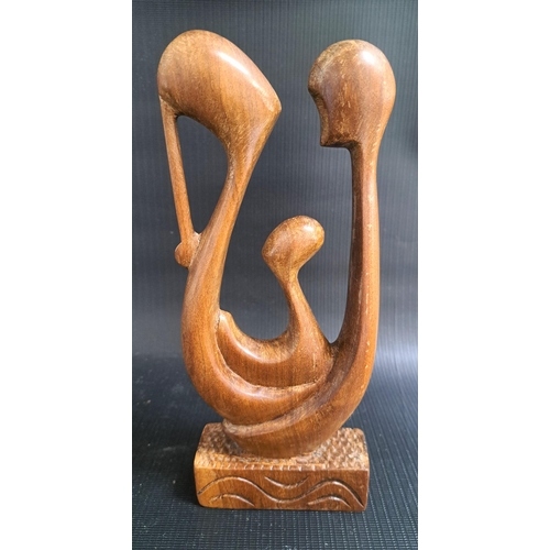 215 - FESTUS IDEHEN (Nigerian b.1928)
mother, father and child, carved teak, signed Festus to the base, 22... 